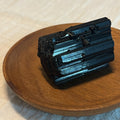 Raw black tourmaline crystal for cord cutting ritual SomnaAura Los Angeles